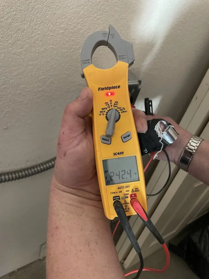 Voltage testing with clamp meter during Outlet Installation in East Ridge